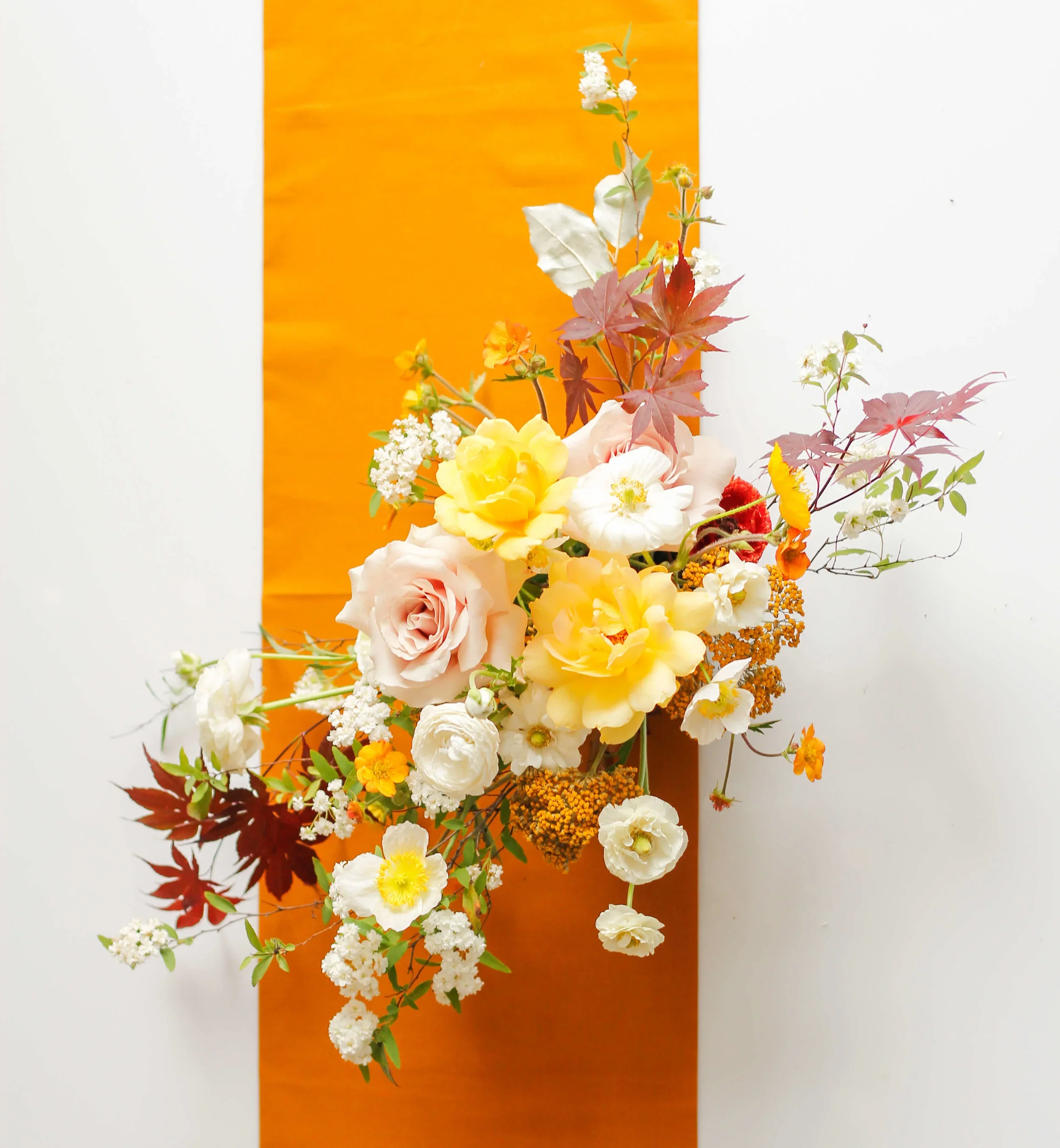 Romantic garden-style bridal centerpiece with soft pastel blooms.jpg.webp