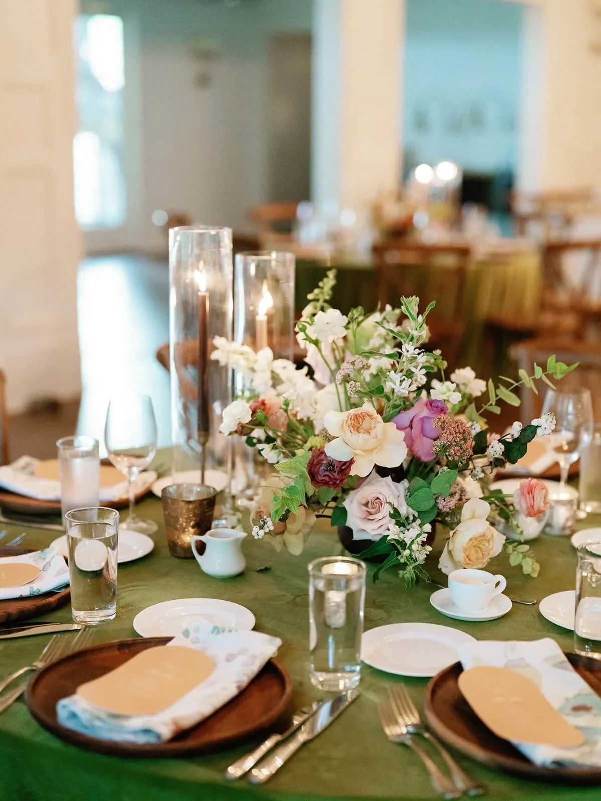 Romantic centerpiece featuring delicate blooms and greenery.jpg.webp