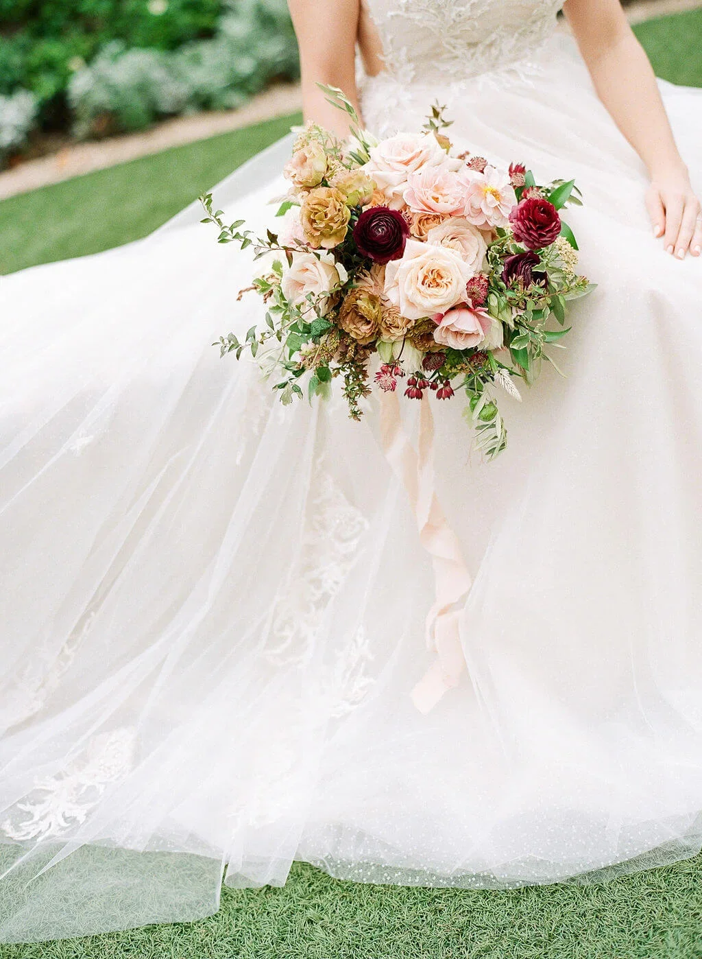 Garden-style romantic bridal bouquet with layered, fall blooms.jpg.webp