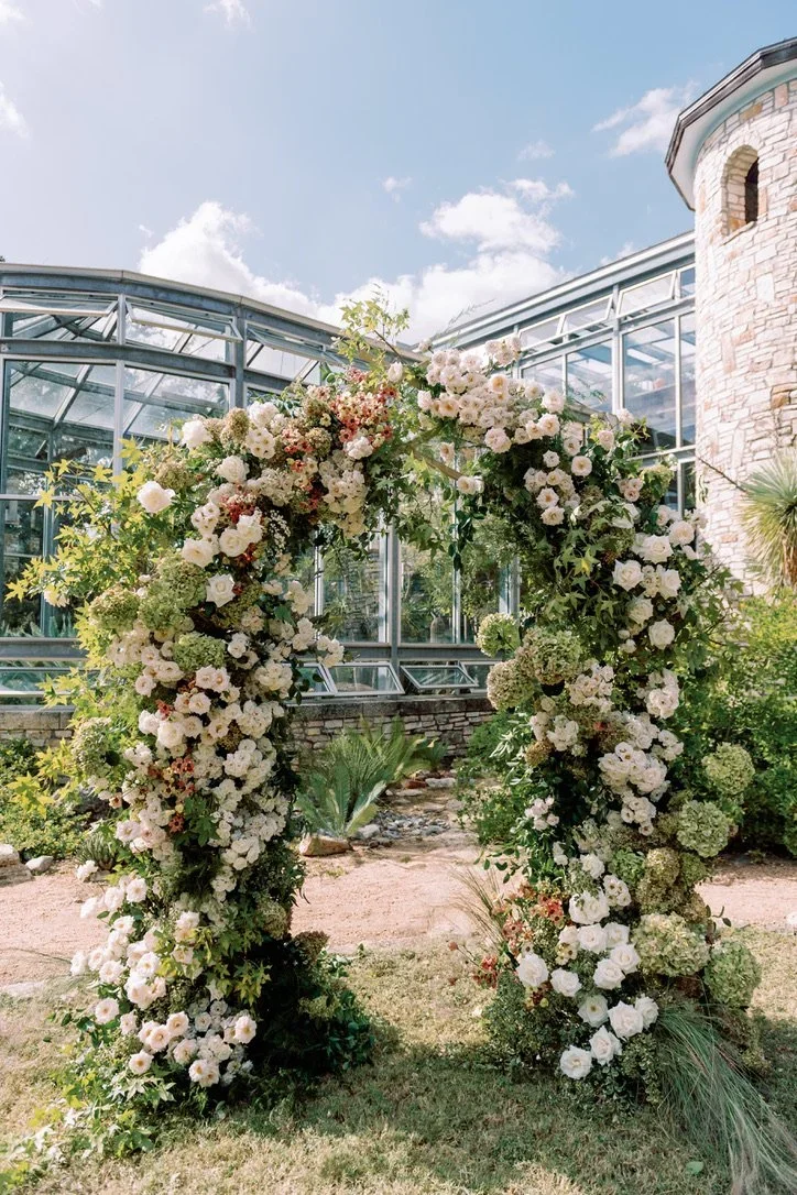 Garden-romantic wedding arch created by a luxury Austin floral studio.jpeg.webp