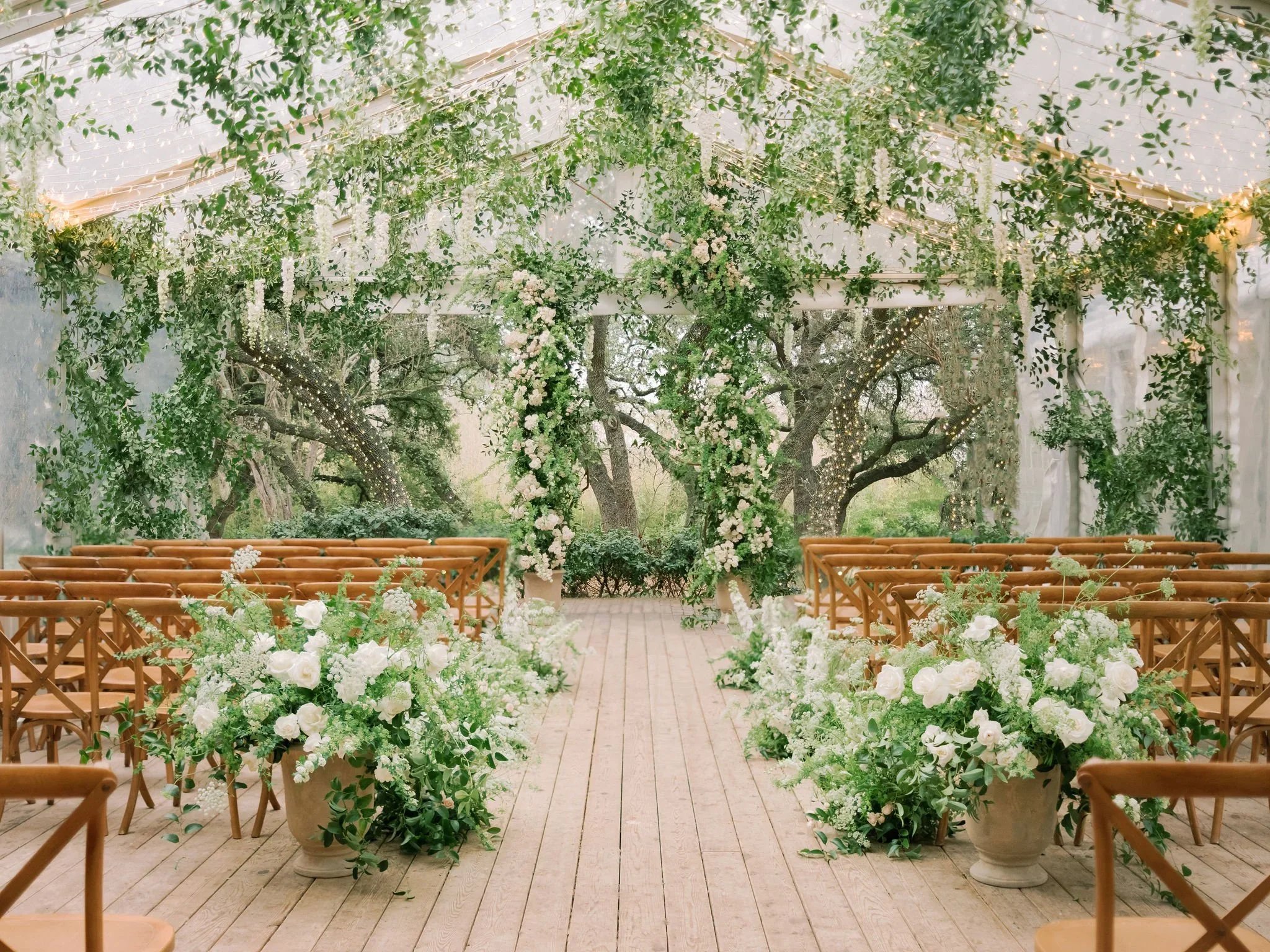 Fine-art romantic ceremony design by an Austin wedding florist.jpg.webp