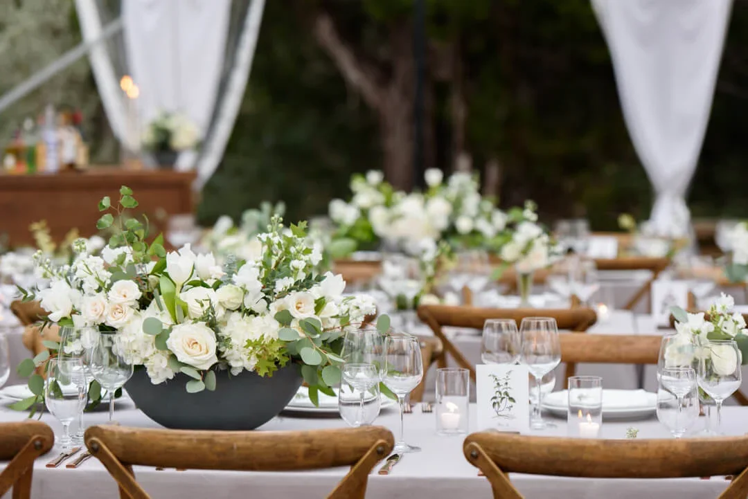 Classic floral centerpiece with white blooms and greenery.jpg.webp
