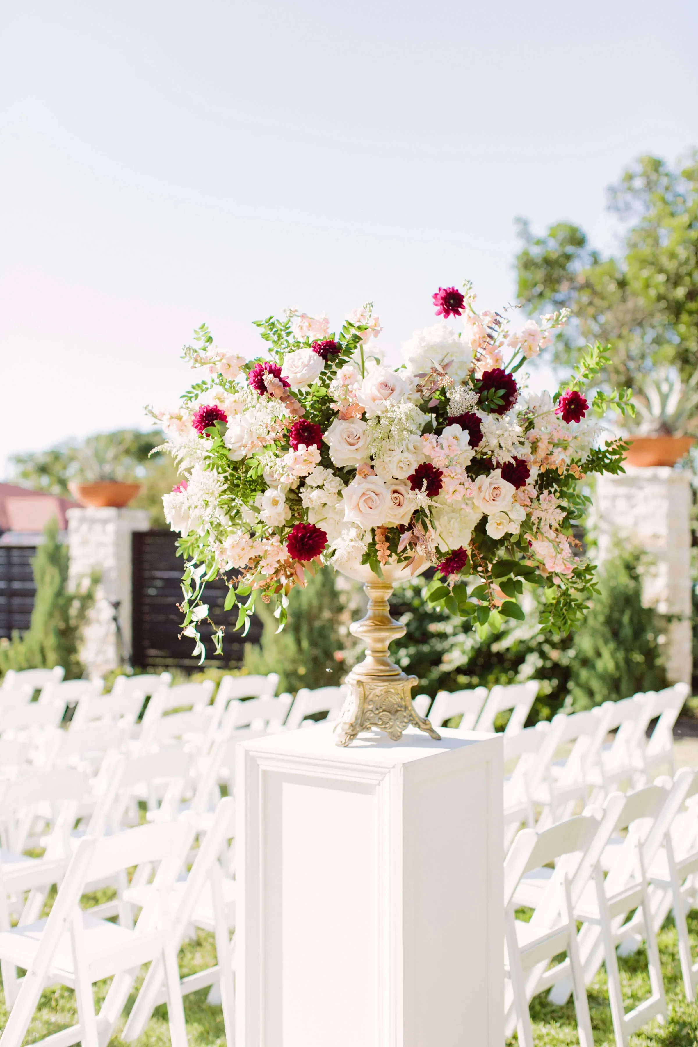 Classic floral urn arrangements with balanced, symmetrical design.jpg.webp