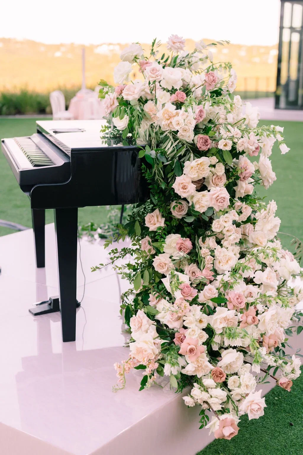 Elegant floral cascade from piano.jpeg.webp