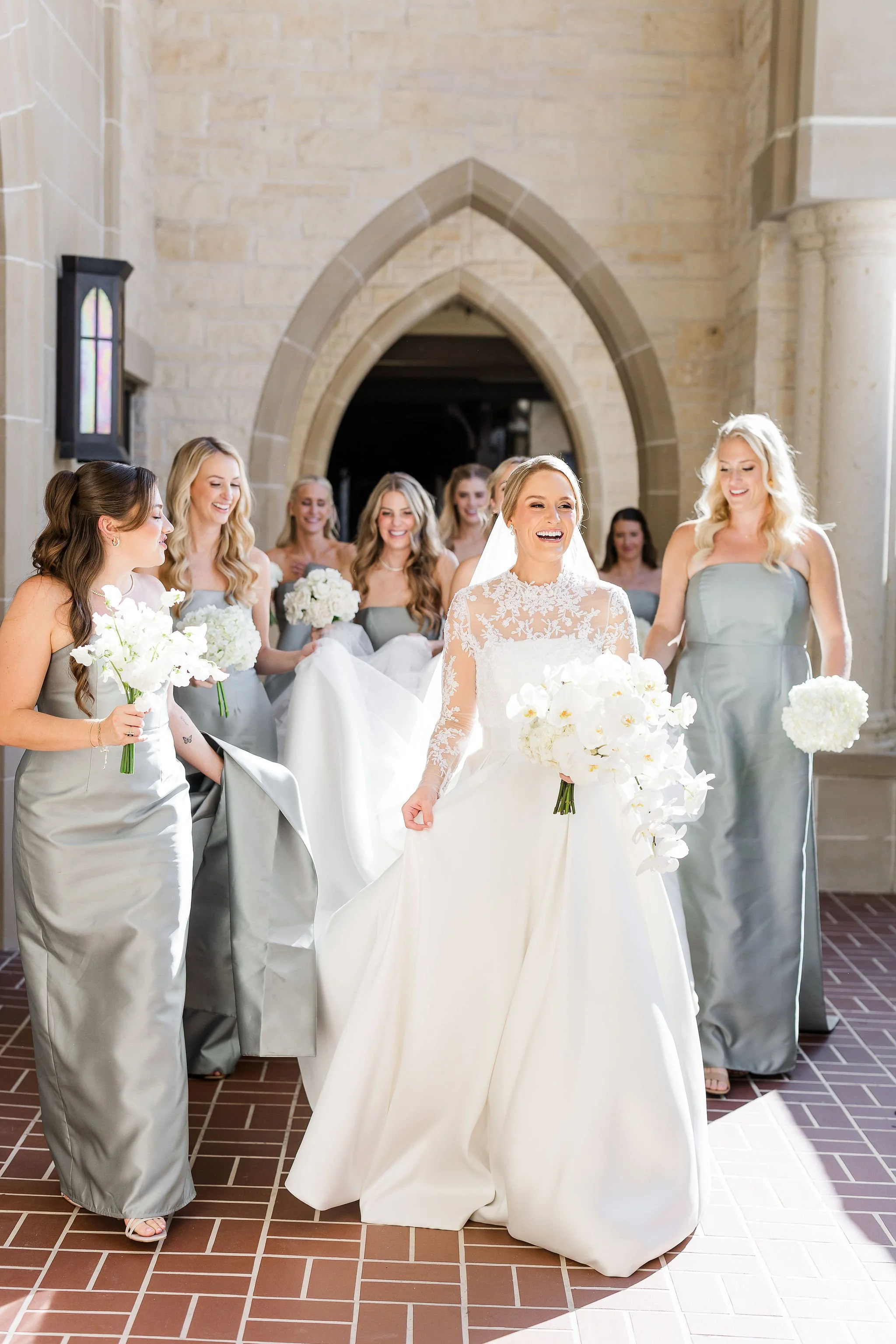 Elegant floral design with monobotanical bridesmaids bouquets in white.jpeg