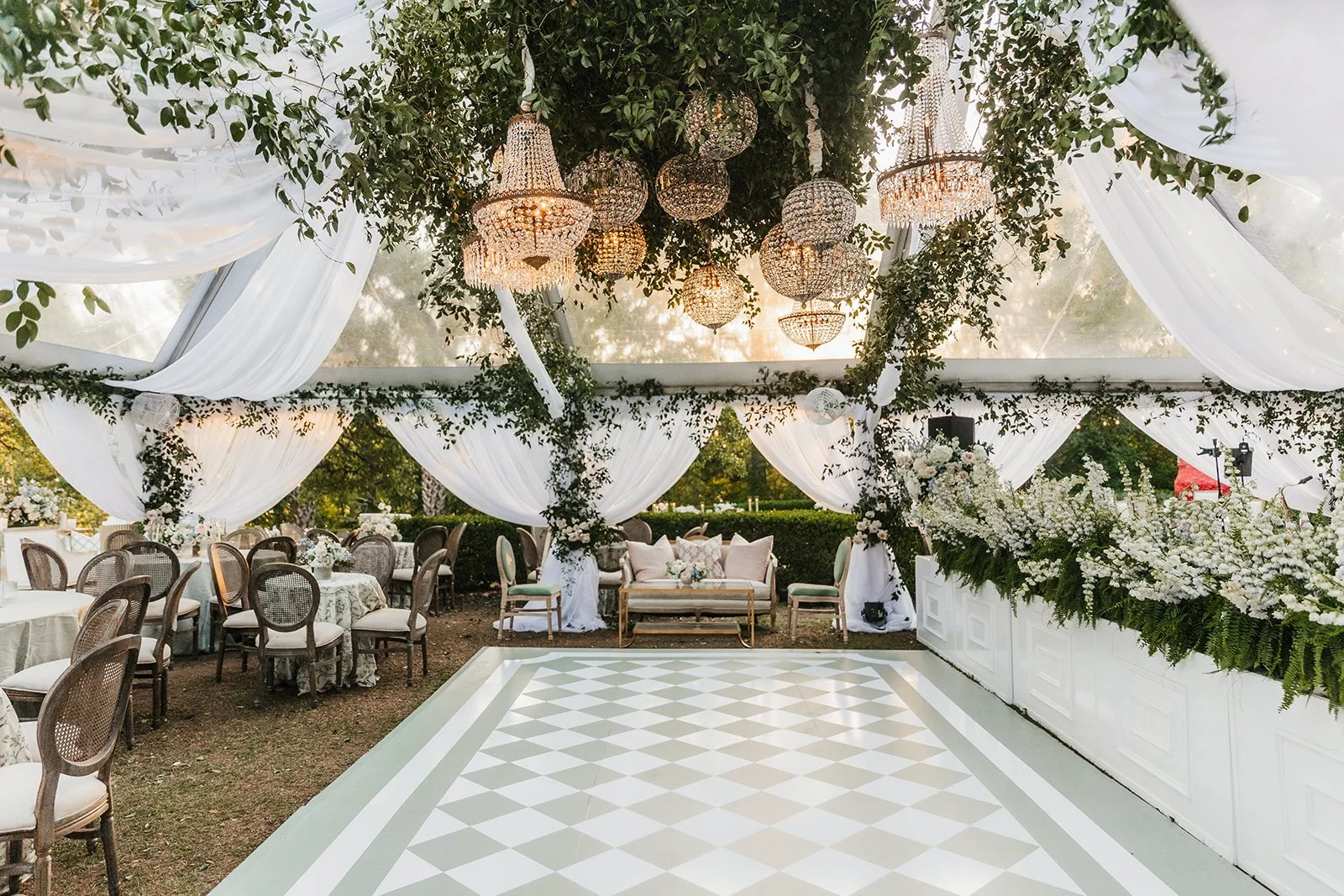 Elegant tent wedding with traditional floral styling.jpeg
