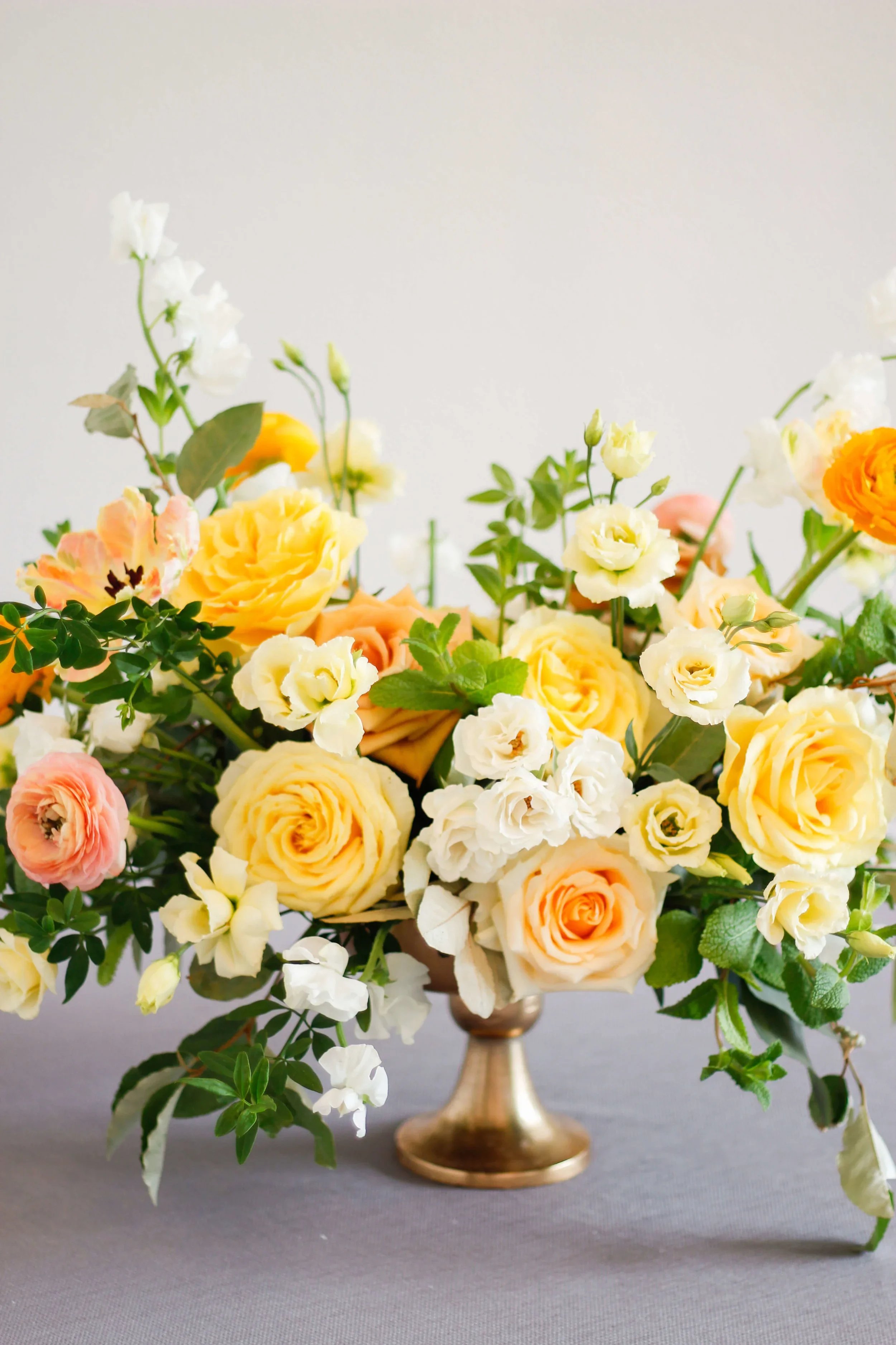 Elegant yellow centerpiece with timeless floral composition.jpg.webp