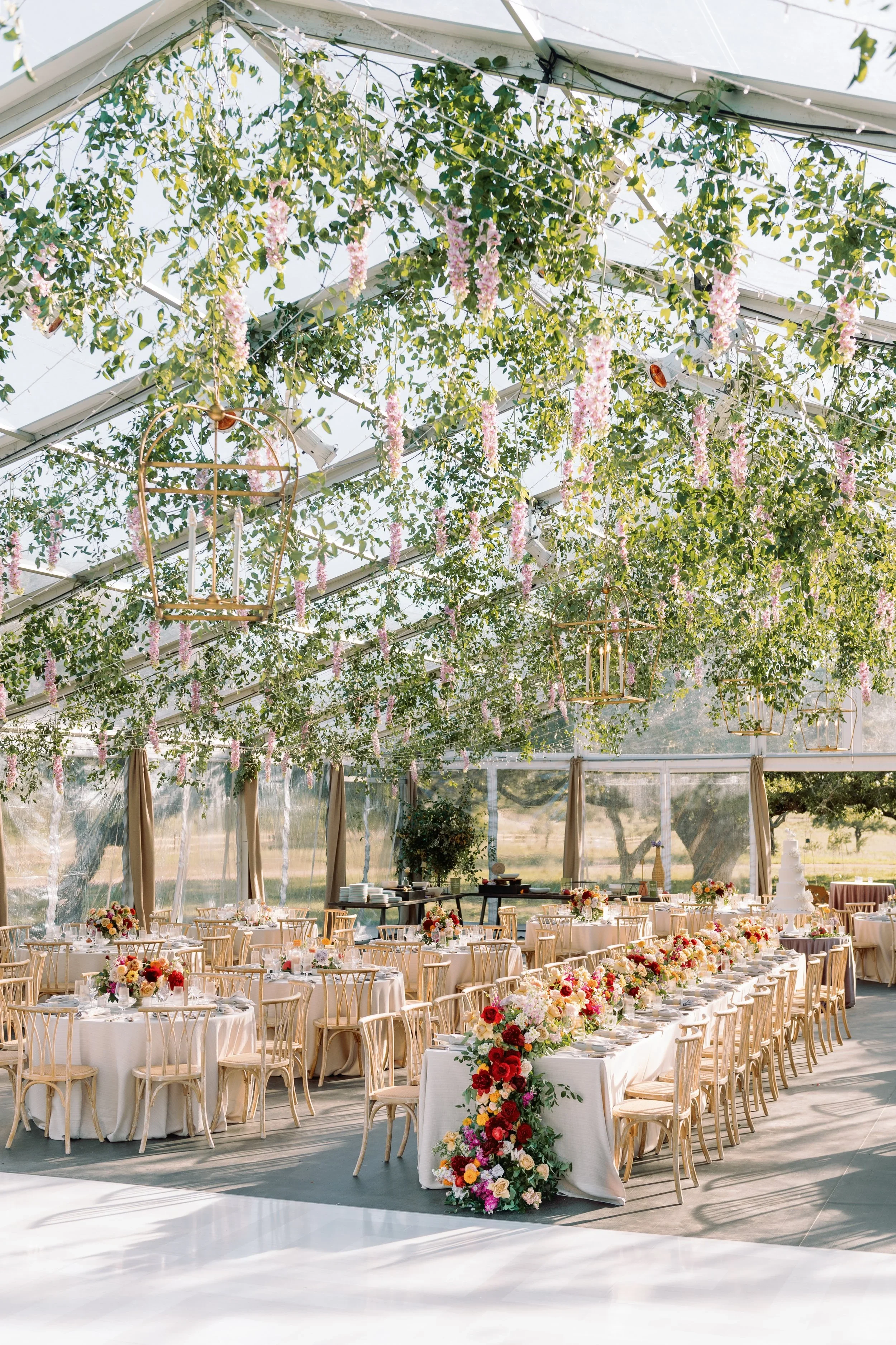 Polished floral runner cascading table florals with timeless beauty tent wedding dripping florals.jpg.webp