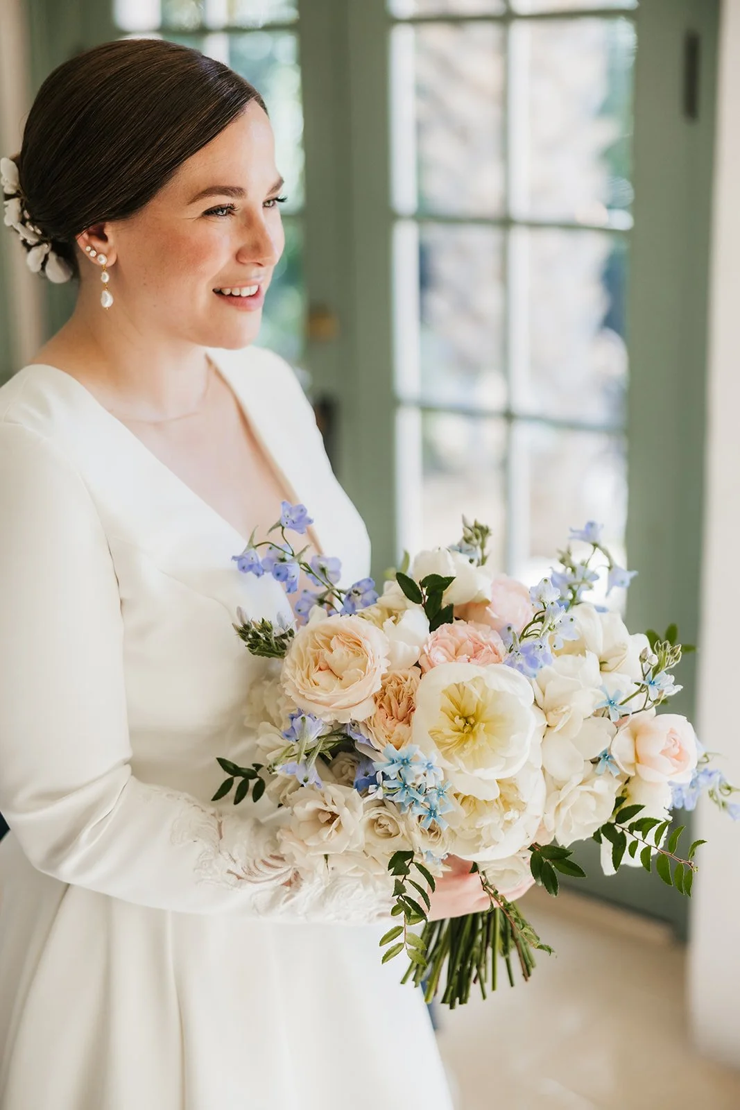 Traditional bouquet in blush and blue with clean floral structure.jpeg