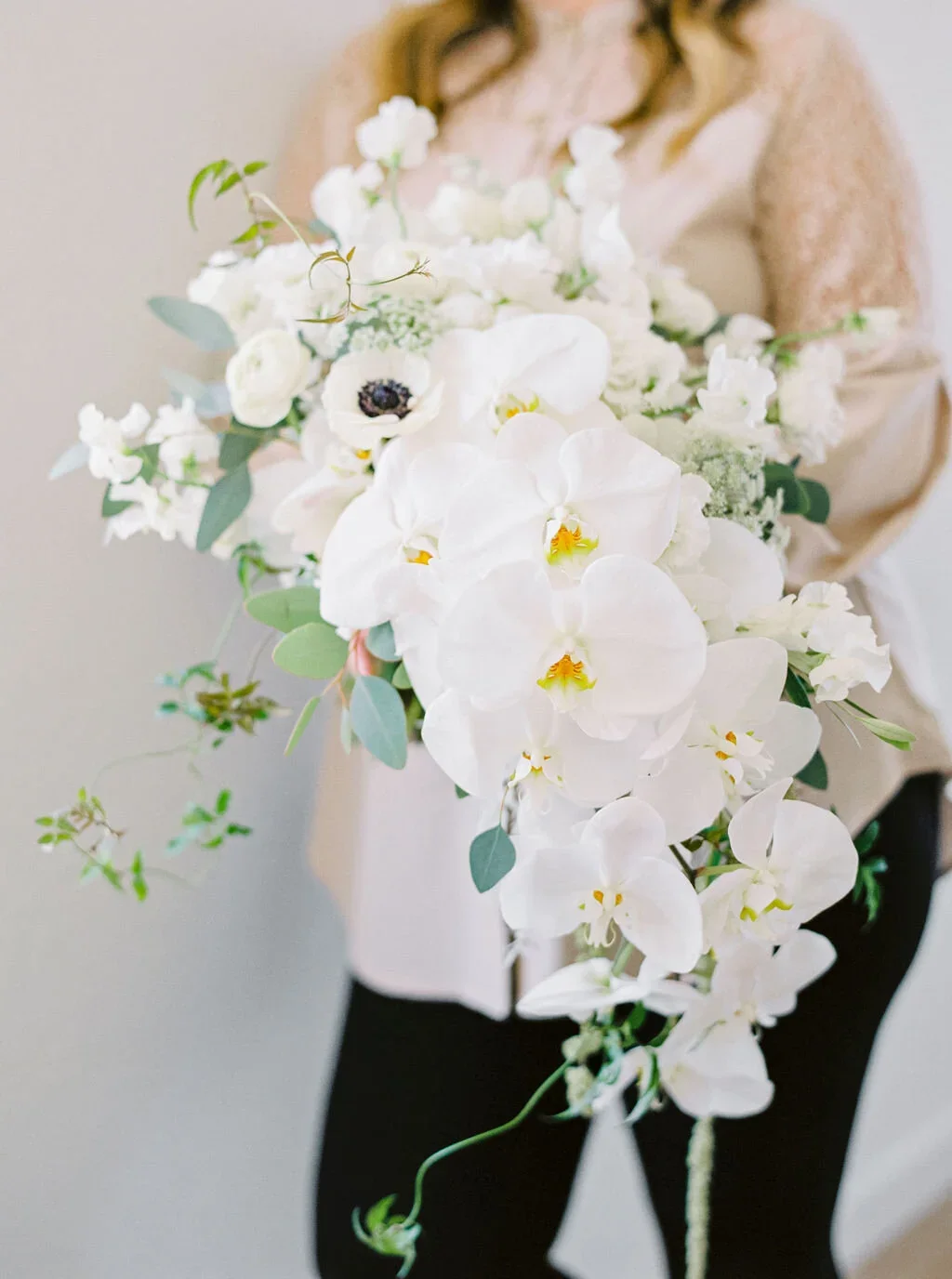 Traditional bridal bouquet with cascading orchids and graceful simplicity.jpg.webp