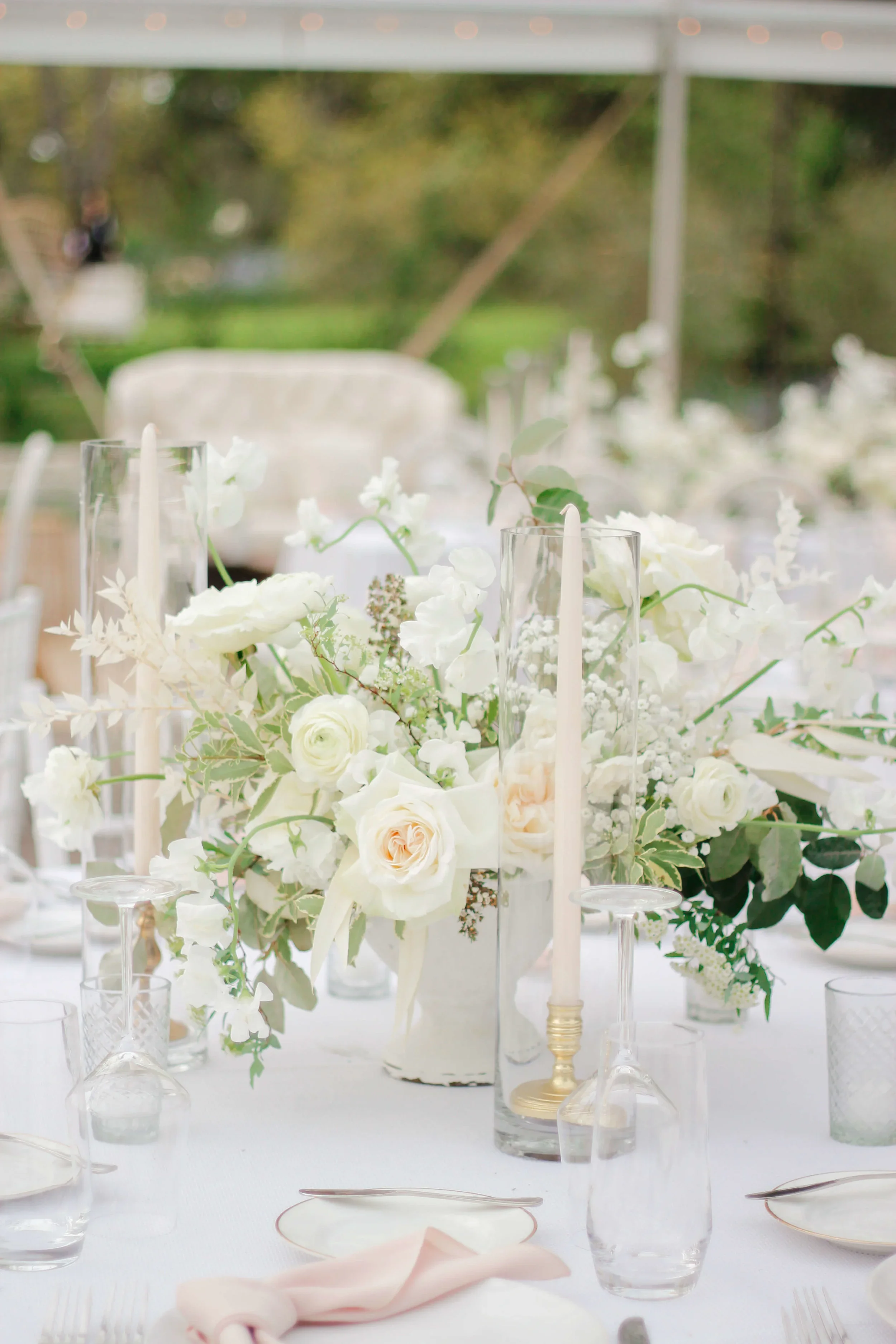 Traditional wedding centerpiece with fresh, refined florals.jpg.webp