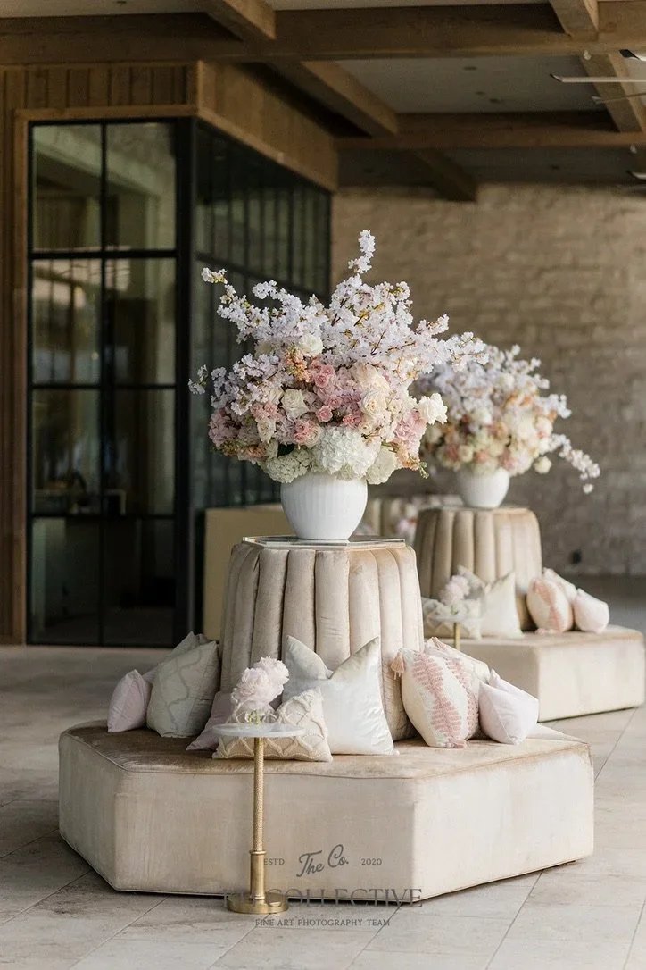 Traditional wedding reception flowers designed by an Austin-based florist.jpeg.webp