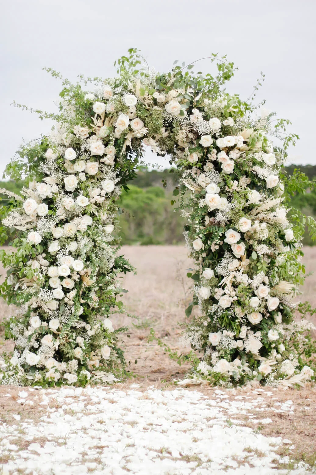 White and green wedding arch with classic styling.jpg.webp