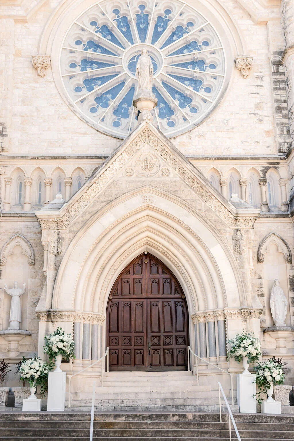 White floral urn arrangements with traditional, tailored design.jpg.webp