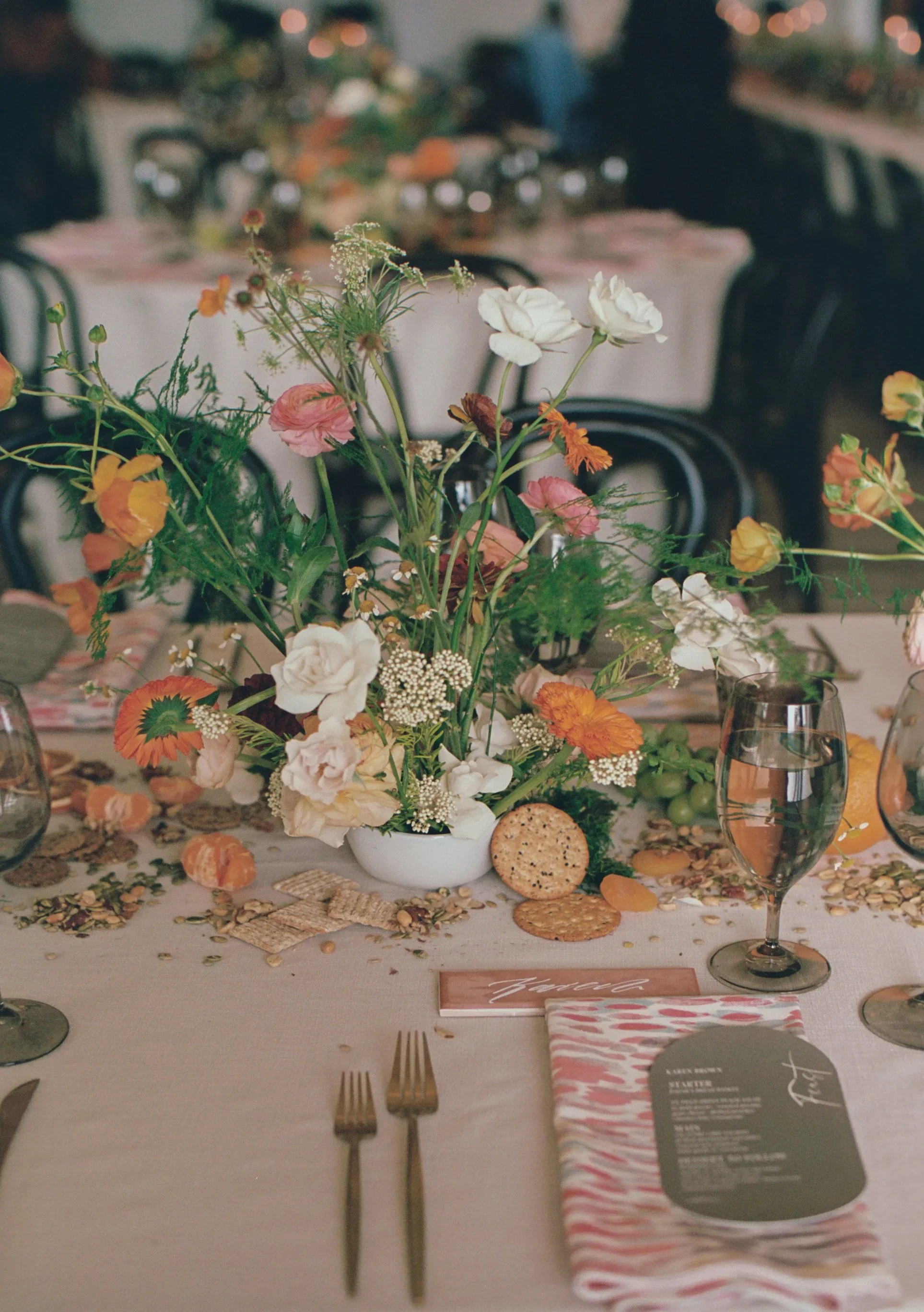 Design-forward floral arrangement with sculptural form and edible elements.jpeg.webp