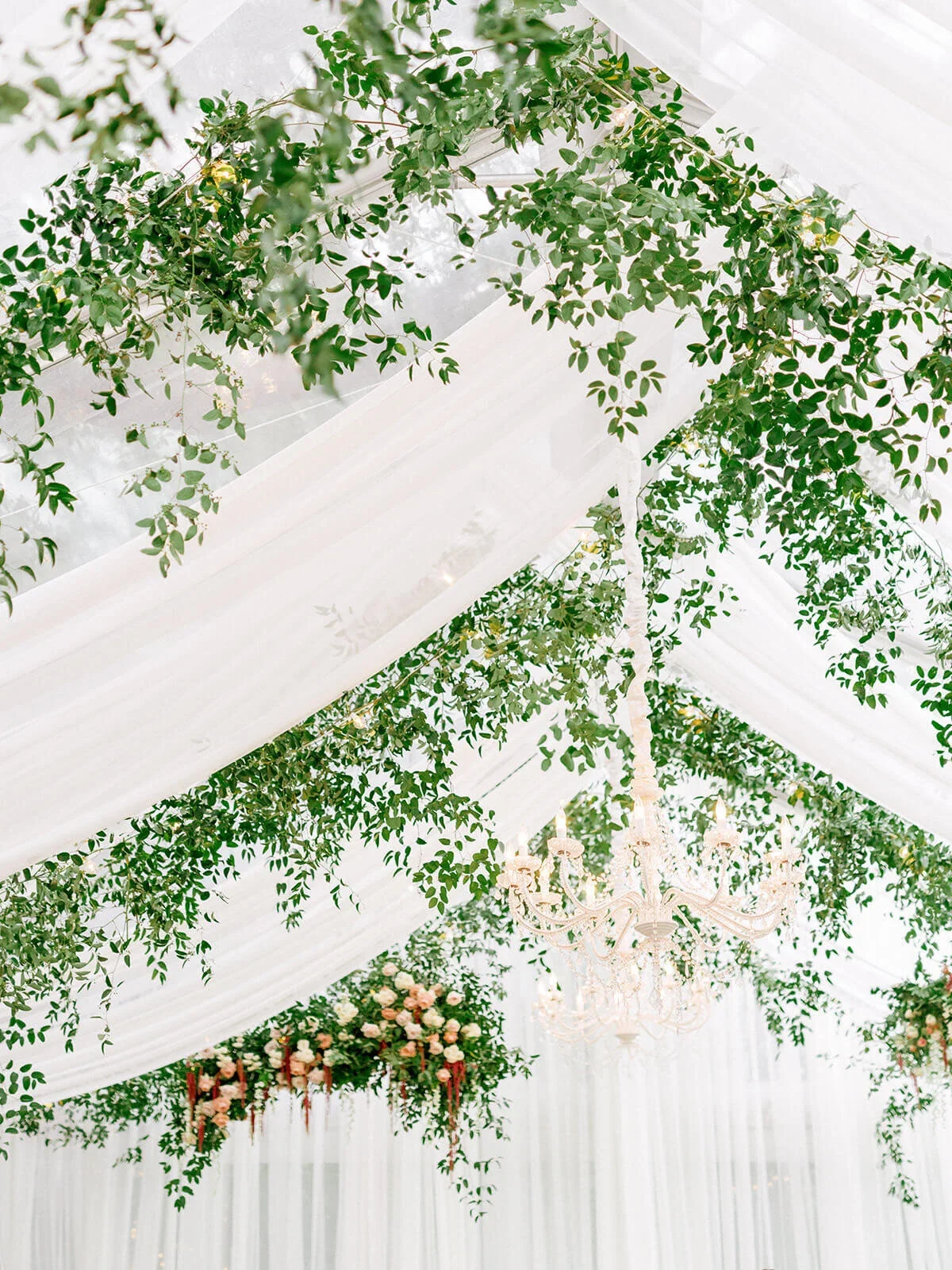 greenery installation in tent with draping.jpg.webp