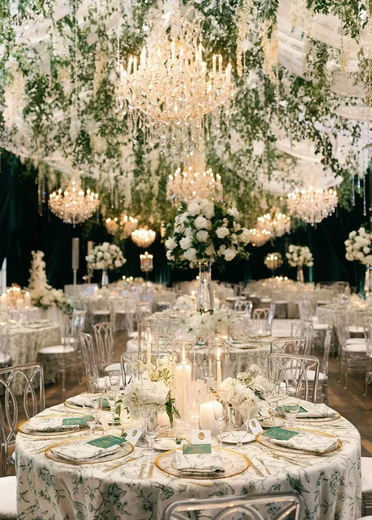 Large scale greenery installation with crystal chandeliers.webp