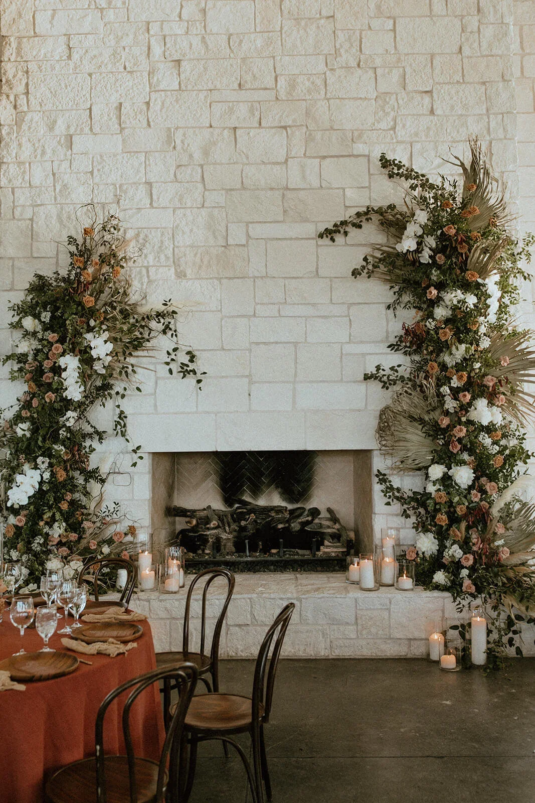 Omni barton creek wedding in austin texas floral installation on fireplace.webp