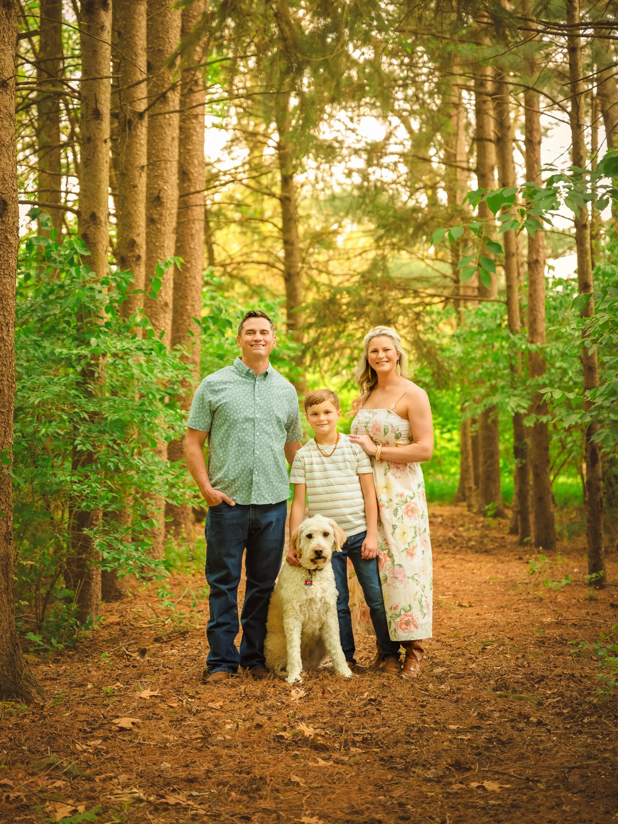This is what I hope families remember. 🤍

Not what everyone was wearing.
Not whether the kids sat still.
Not whether the dog cooperated.
Just this.

A summer evening beneath the pines. Three generations together. Big smiles, warm hugs, and the peopl