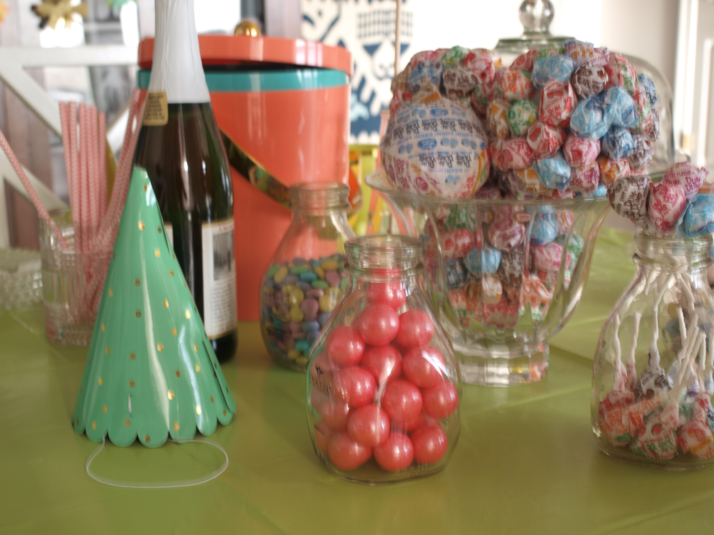 Shatto Milk bottles held lots of candy. Target's new line Oh Joy were the jumping point for this colorful party and of course a little sparkling grape juice made it complete.