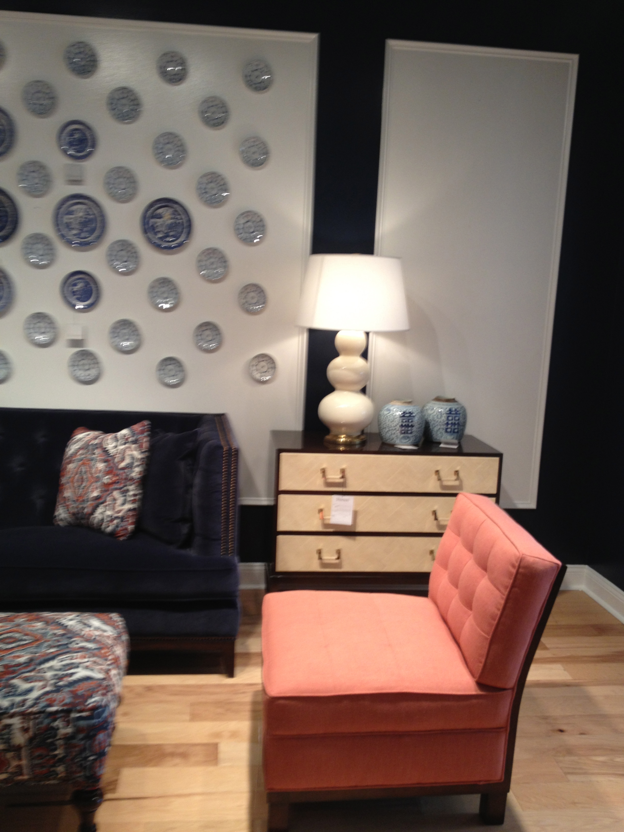 An slipper accent chair in coral is perfect paired with the blues. www.saranobledesigns.com