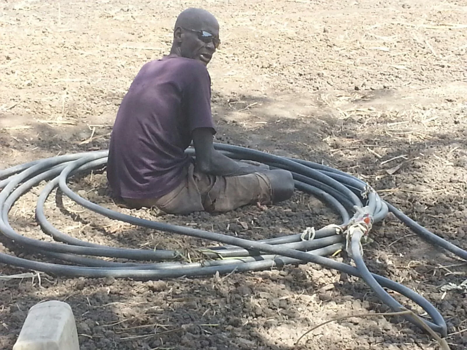  One of the volunteers fixing the horse which we water the garden 