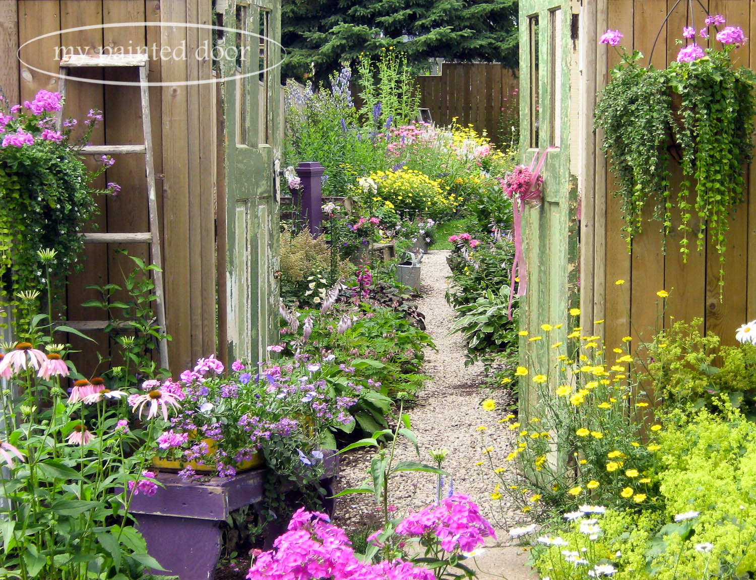 My Country Garden - Sue Sikorski's zone 3 garden - garden entrance through old doors.