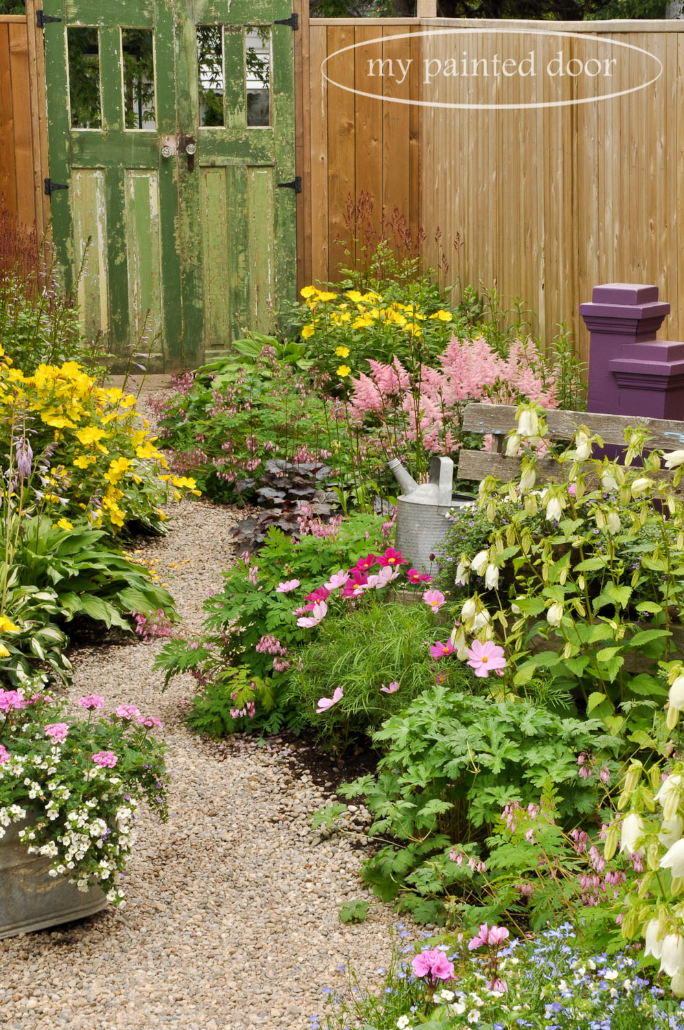 My Country Garden - Sue Sikorski's zone 3 garden - path leading to an old door.