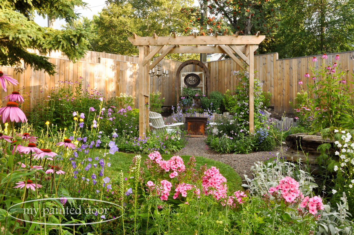 My Country Garden - Sue Sikorski's zone 3 garden - garden arbour with chandelier.