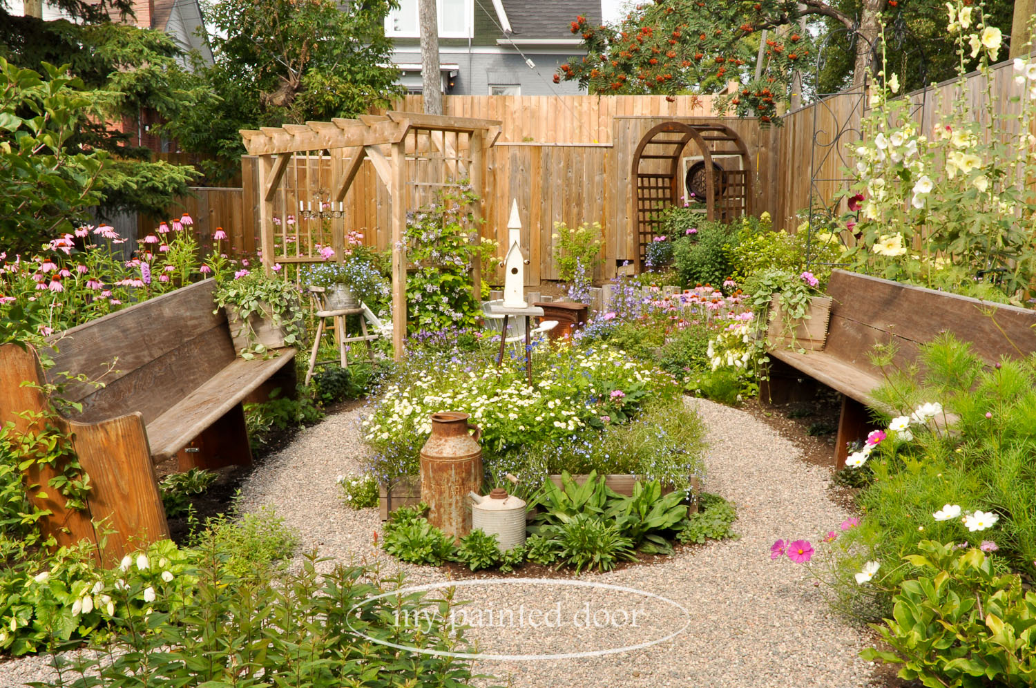 My Country Garden - Sue Sikorski's zone 3 garden - church pews in the garden.