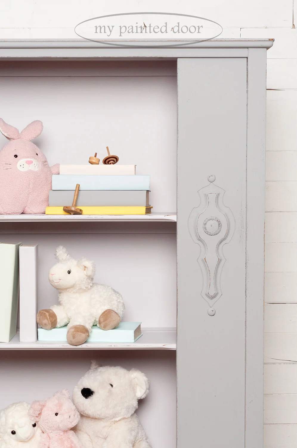 Hutch painted in Fusion Mineral Paint in the colours Little Lamb and Little Stork. The books on the hutch are painted in all the colours in the Jennylyn's Tones for Tots Collection.