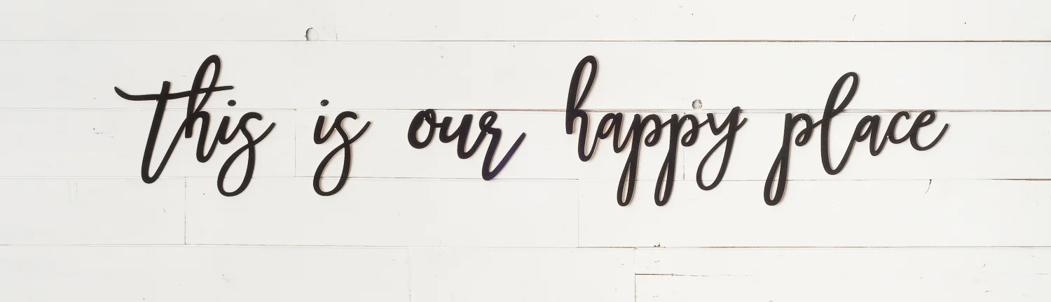Laser cut words - this is our happy place - painted in Fusion MIneral Paint in the colour Coal Black. Words available online at My Painted Door.