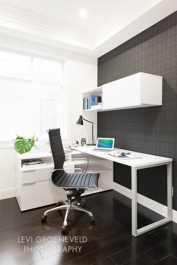 The office, located just off of the great room, also features a geometric wall covering to add interest to the space. The desk offers plenty of storage and workspace for at home affairs. 
