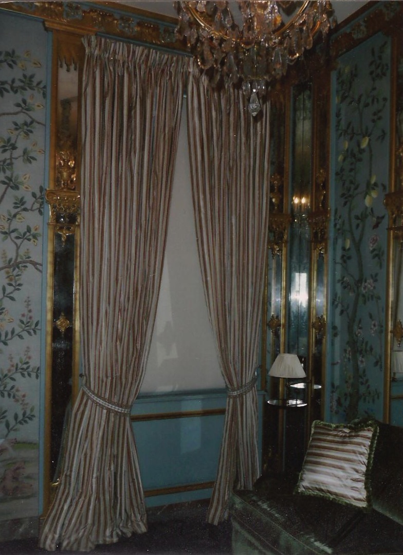 Kuwait- Stripe silk curtains with "Holland" roller blind in room with hand painted fabric upholstered panel walls