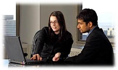 2 people at desk cropped.jpg