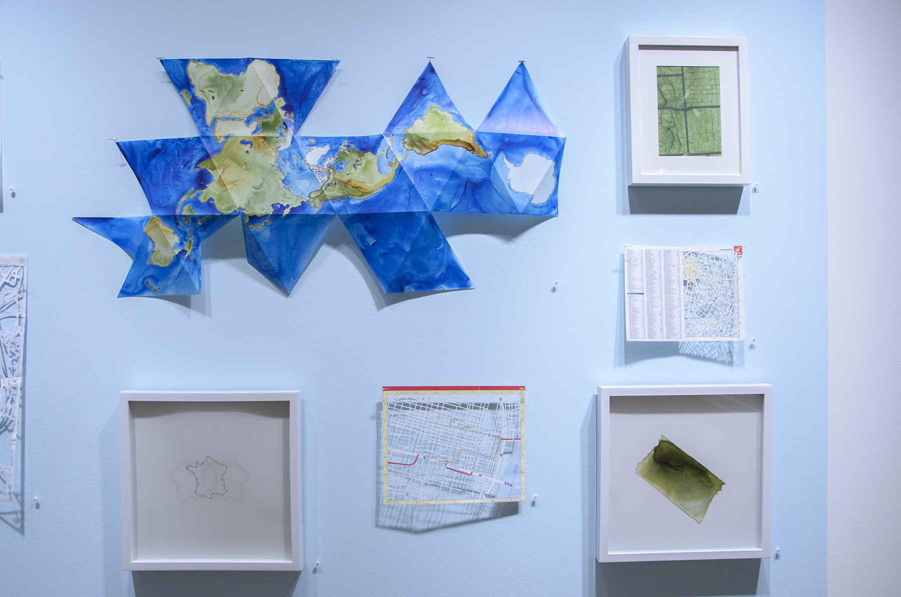  Clockwise from top left: Buckminster Fuller Dymaxion Map, Memphis, Paris, Tennessee (distorted), St. Louis, France 