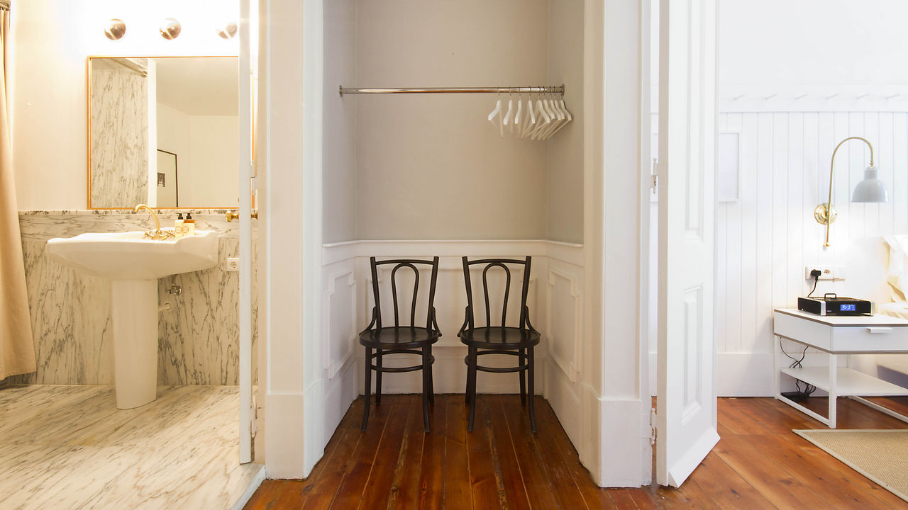 Suite has spacious hanging closets, bathrooms and a bedroom.