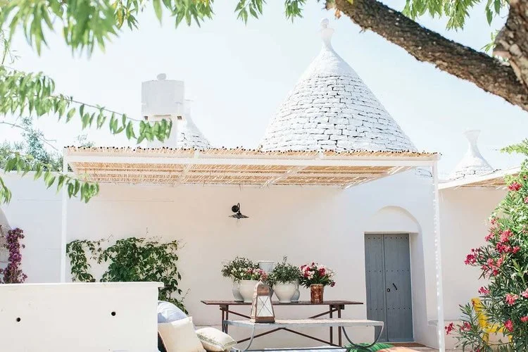 The picturesque white stone walls of boutique bed and breakfast, Fikus. Image © Marta Puglia 
