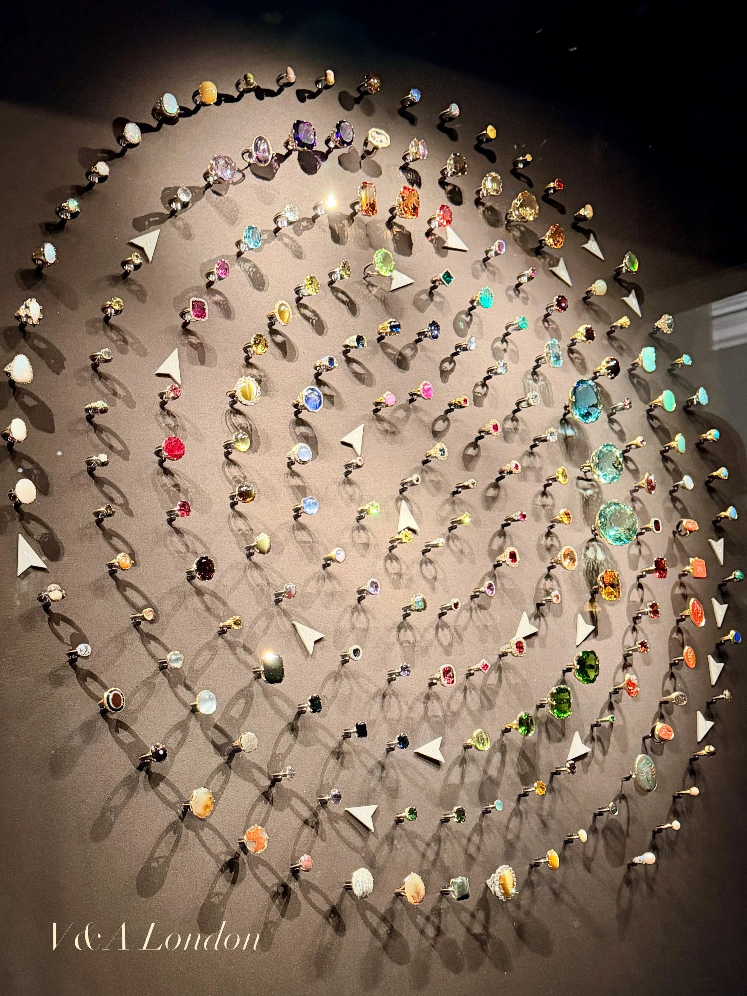 I heard we were bringing back single image posts ✍️

#london #victoriaandalbertmuseum #england #jewelry #sparkly 

A circular arrangement of rings composed of various colors, hues, shapes, and sizes, on exhibit at the Victoria and Albert museum in Lo