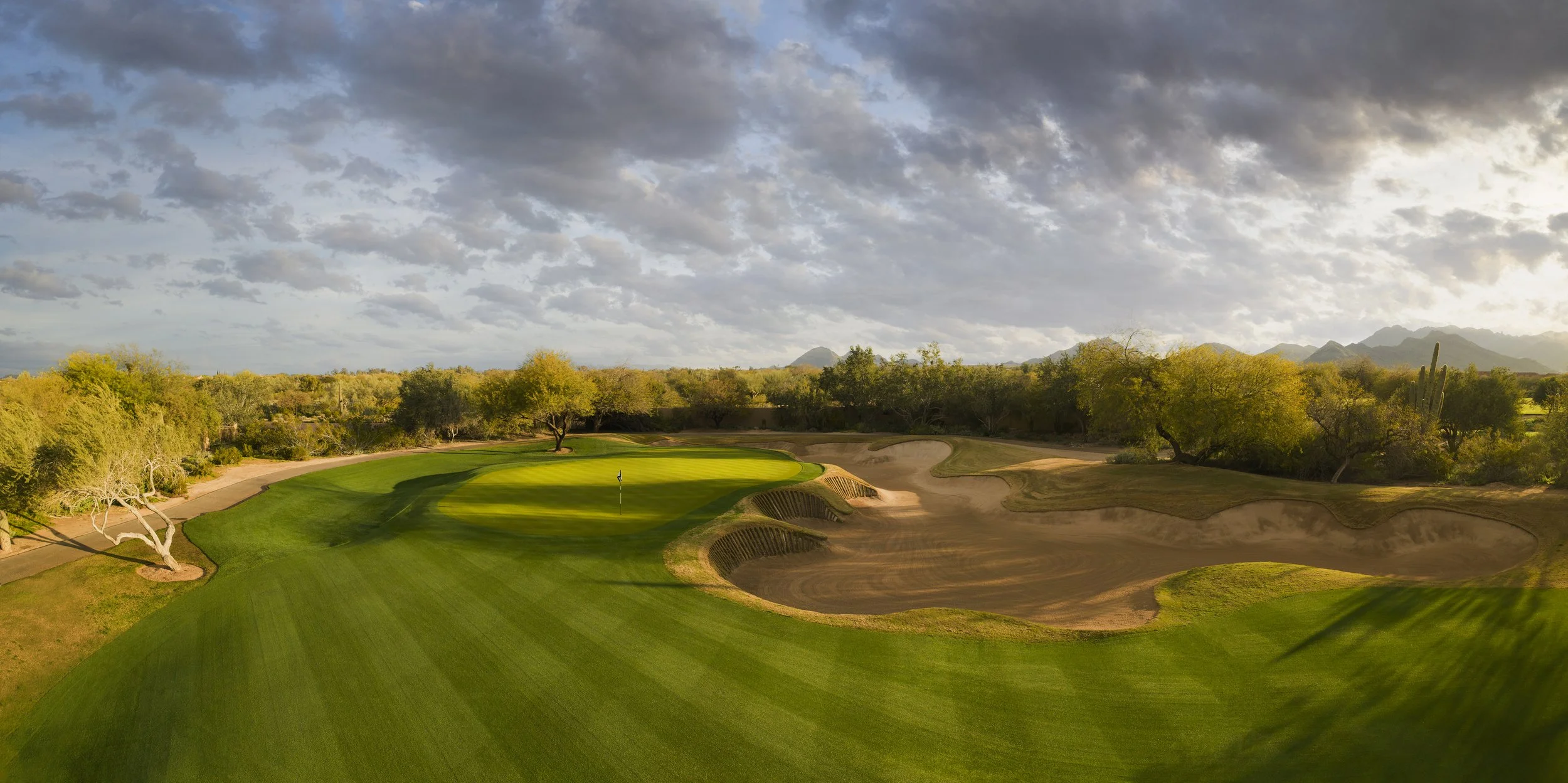 Photograph of Grayhawk Golf Club, a desert golf course with rolling fairways framed by native desert vegetation and surrounding mountains