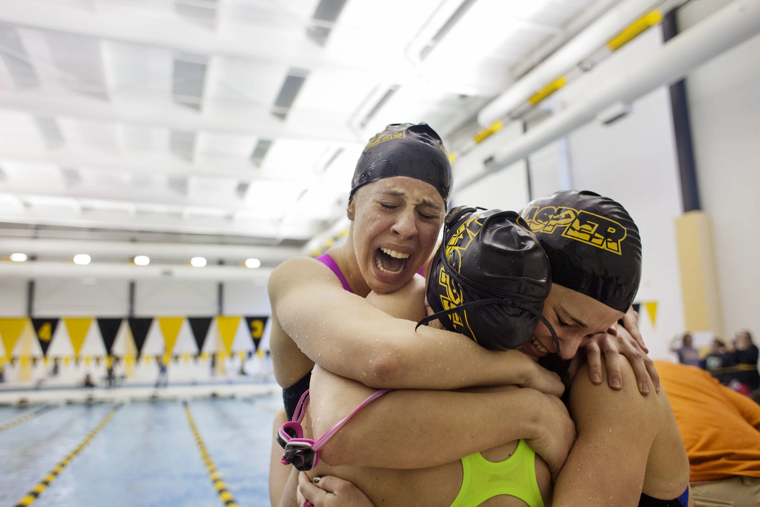   7 Feb. 2015, Jasper, IN --&nbsp; Jasper's Emma Hopf, left, celebrates with teammates Cady Mehringer, Lindsey Mehringer and Payton Painter after the quartet established a school and sectional record in the 200-yard medley relay race during the girls
