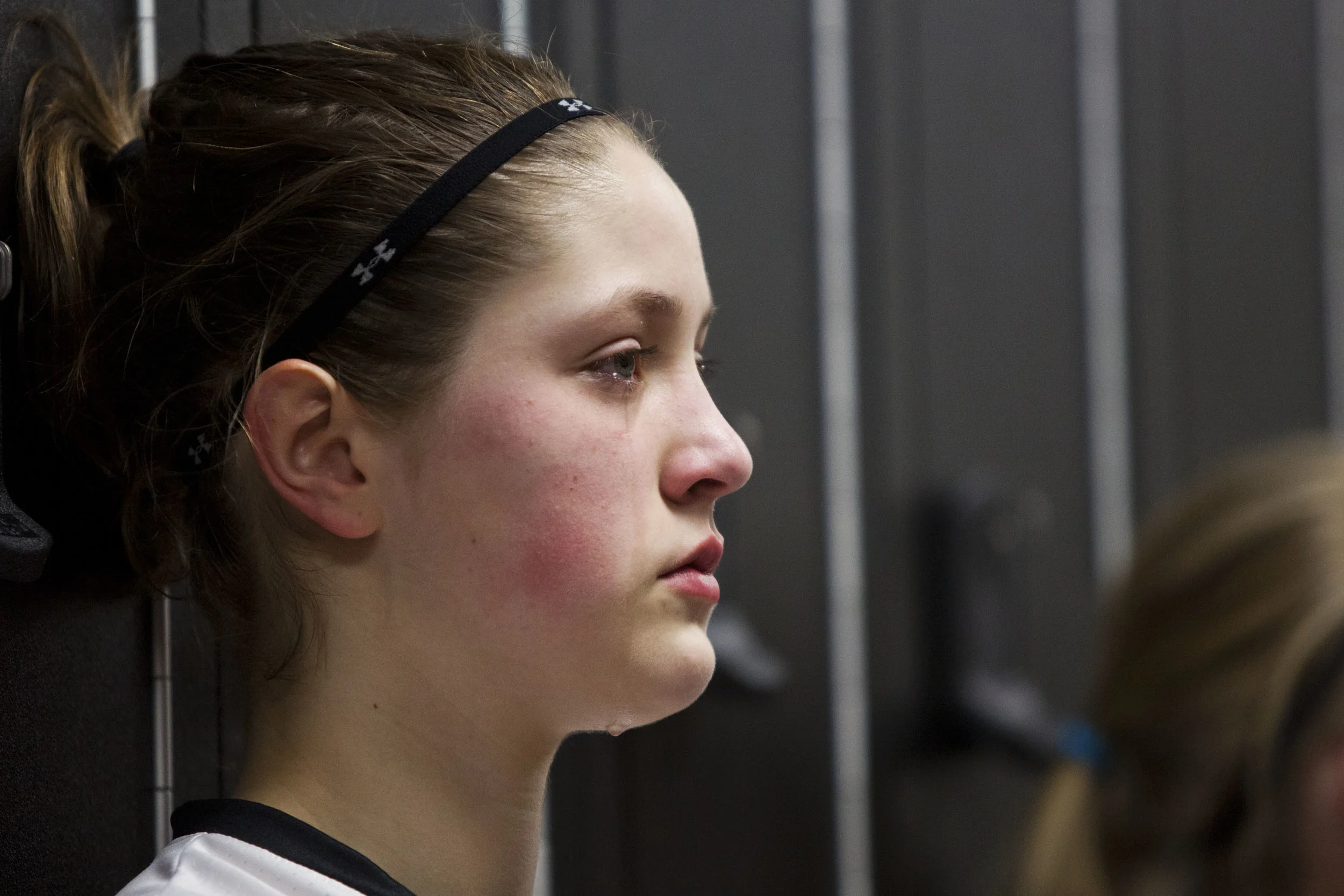   11 Feb. 2015, Jasper, IN --&nbsp; Southridge’s Sydney Altmeyer sheds a tear in the locker room after the Raiders’ season ended in a 38-36 loss at the buzzer to Washington in Wednesday’s Class 3A girls basketball sectional in Jasper. The Raiders gai