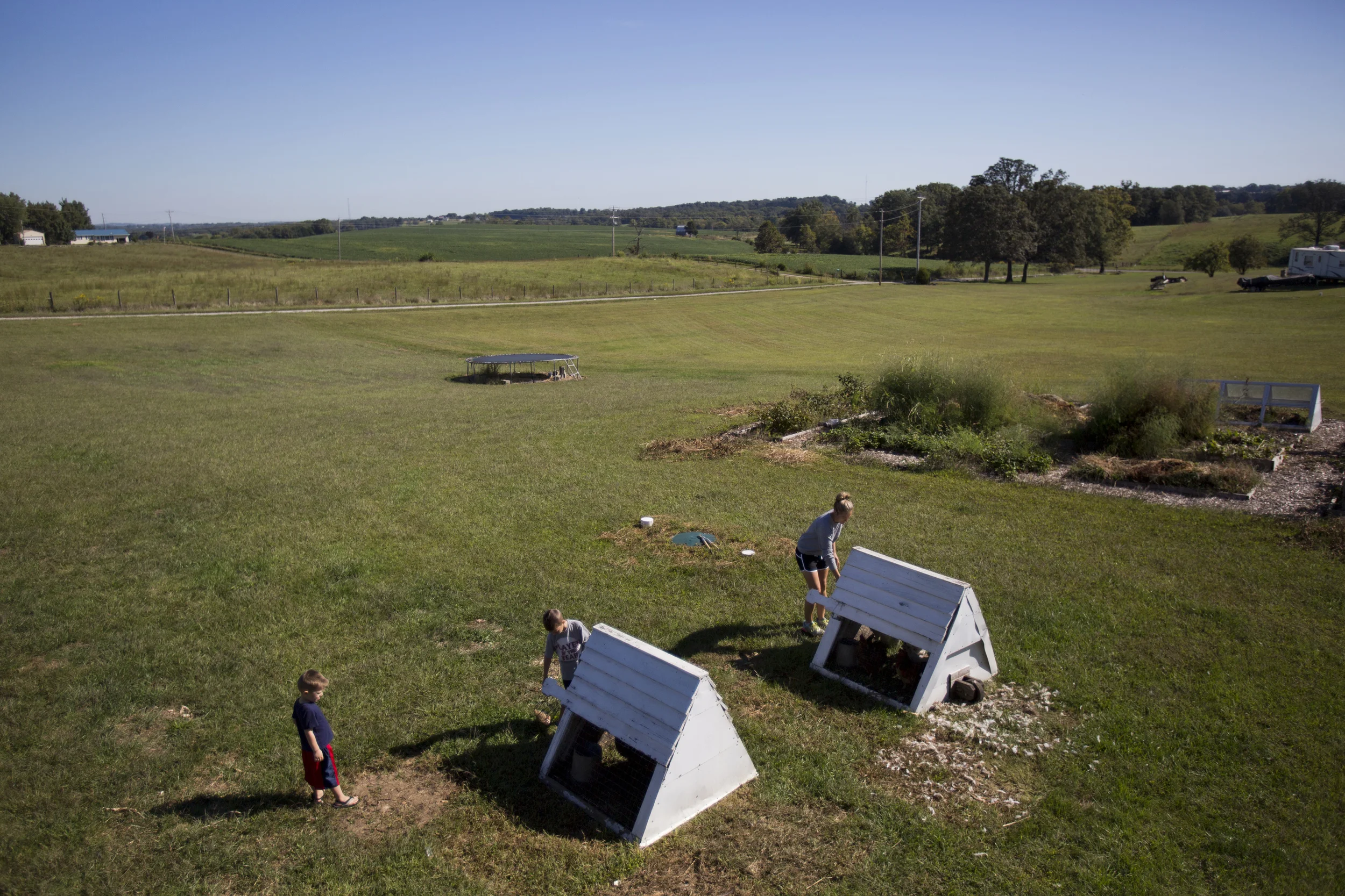  Kim Hotop gathers eggs from the chicken coops in their back yard with her sons Andrew, 7, center and Augustin, 4, right, on Tuesday, Sept. 22 in Perryville. The family also has a garden where they grow fruit and vegetables throughout the summer and 