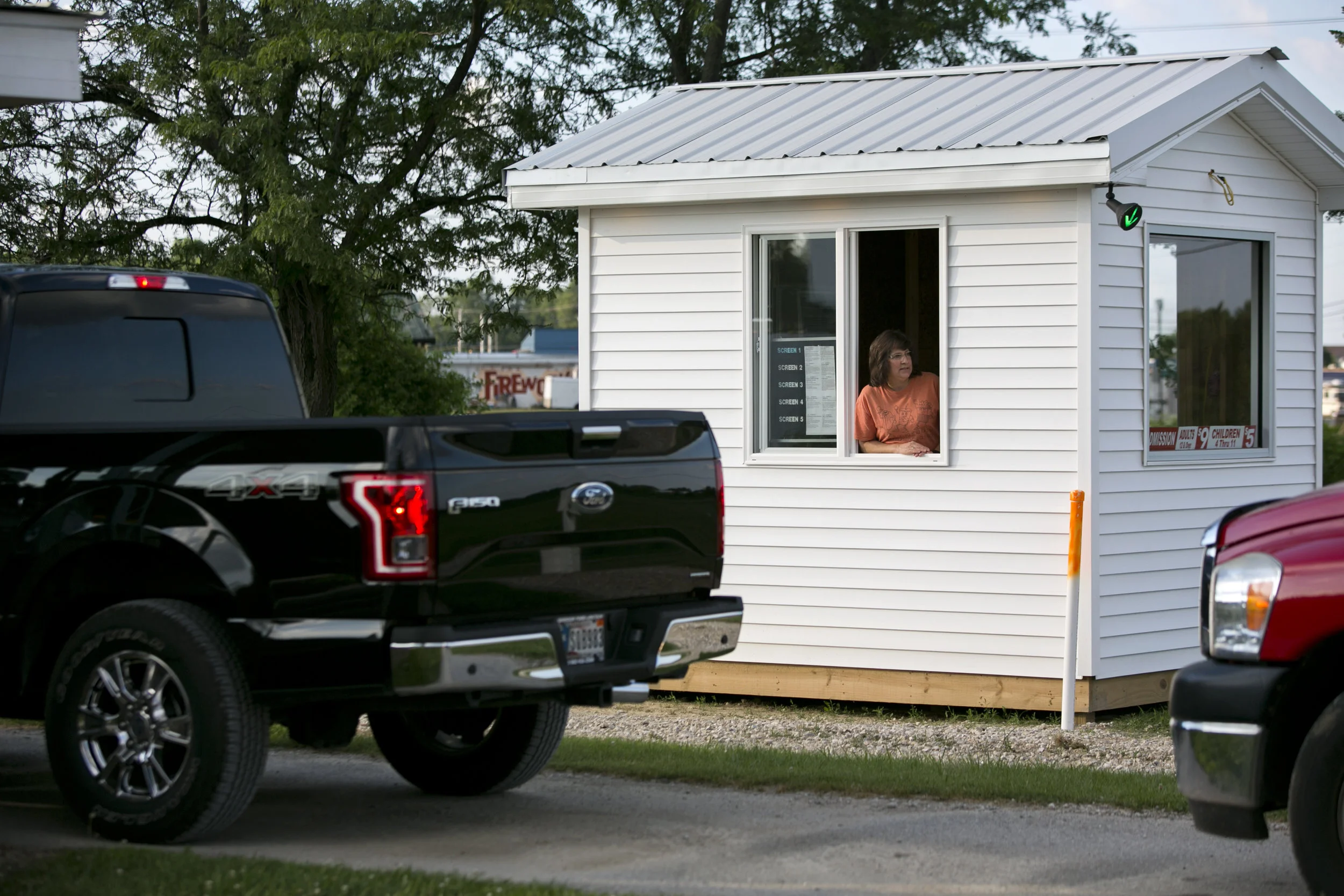   Elaine Jones of Rockport greeted customers at the front gate of Holiday Drive-In on June 17 in Reo. Jones said she likes working at the gate because she gets to see new customers’ excitement as they enter for the first time. She said many people ar