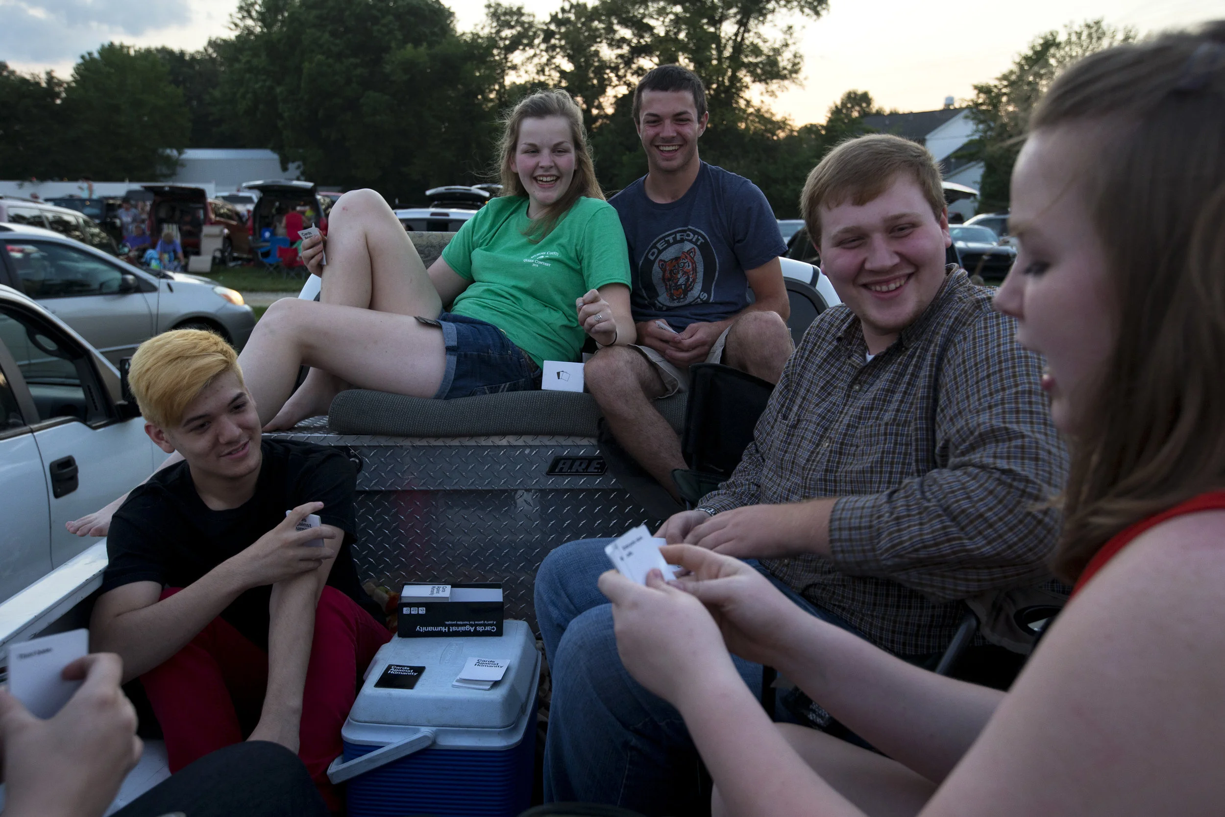   Jessica Schaeffer, second from left, sat with Luke Durcholz, both 18 and of Huntingburg, as they played cards with friends, Isaac Hurt of Gentryville, 18, left, David Romans of Rockport, 20, second from right, and Lindsey Schaeffer of Huntingburg, 