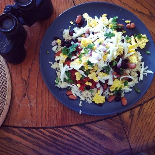 Mexican burrito bowl lunch -- rice, beans, shredded jicama, corn, salsa, cilantro and lime juice.