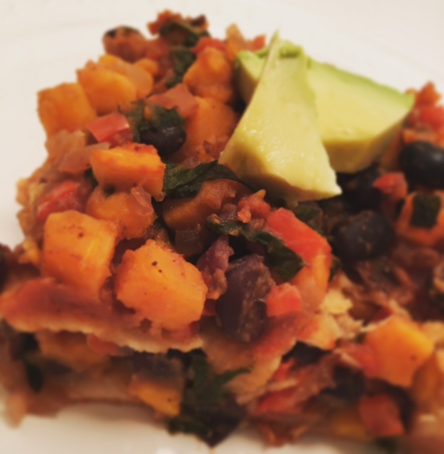 The Oh She Glows Cookbook enchiladas with extra filling and avocado on-top.