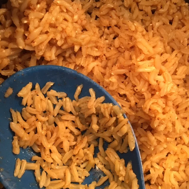 Brown rice cooked in vegetable stock with spices.