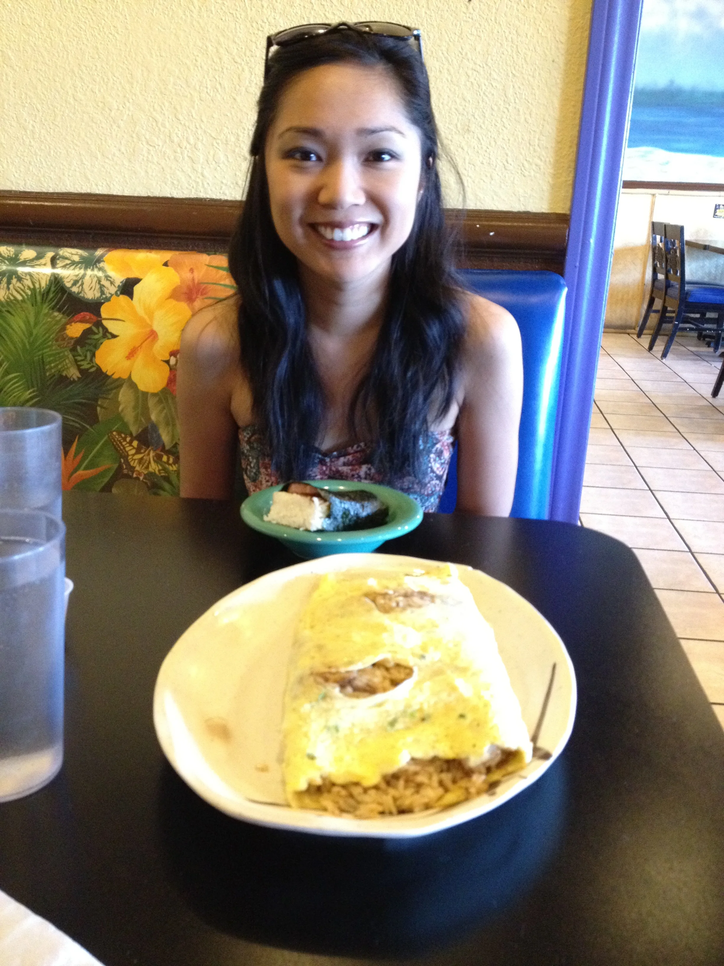 Aloha Kitchen’s Adobo Fried Rice Omelet, with Amanda in the background.