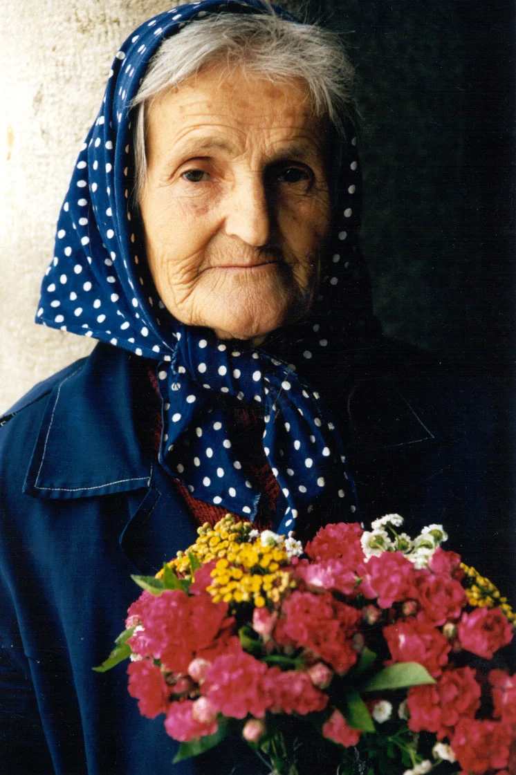 oldwomanwithflowersSHOPfaces.jpg